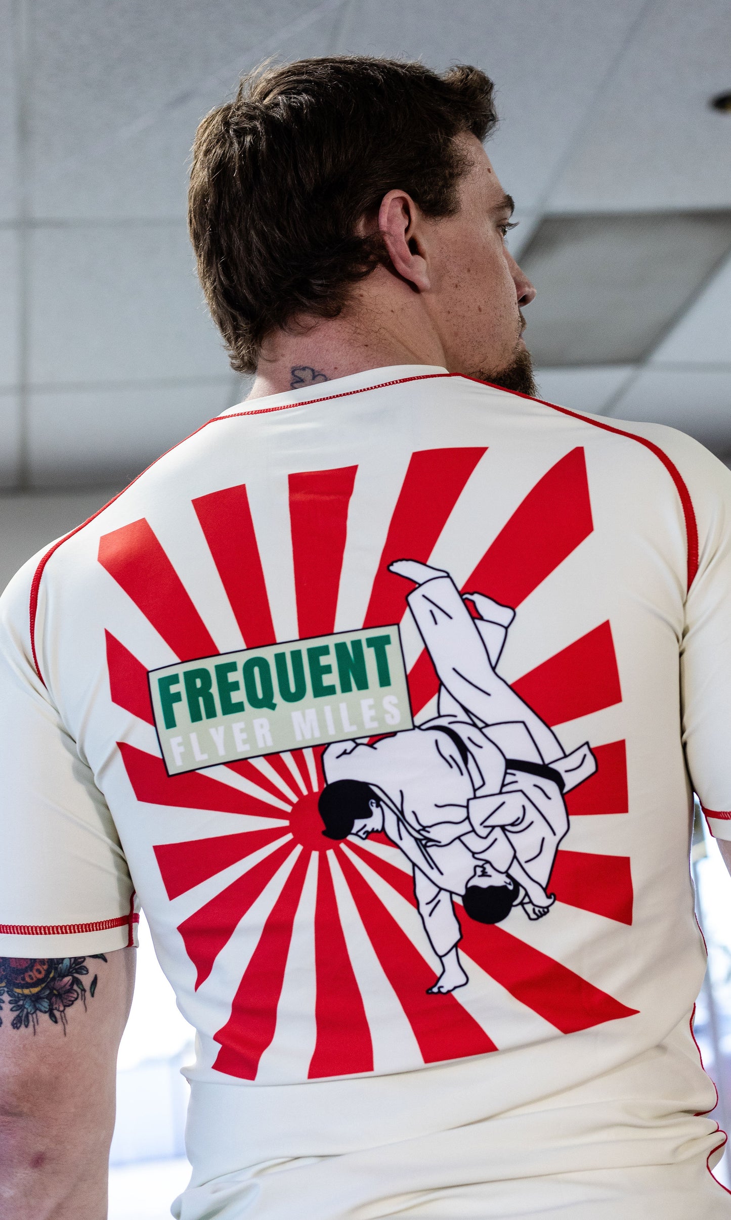 "FREQUENT FLYER MILES" RASHGUARD